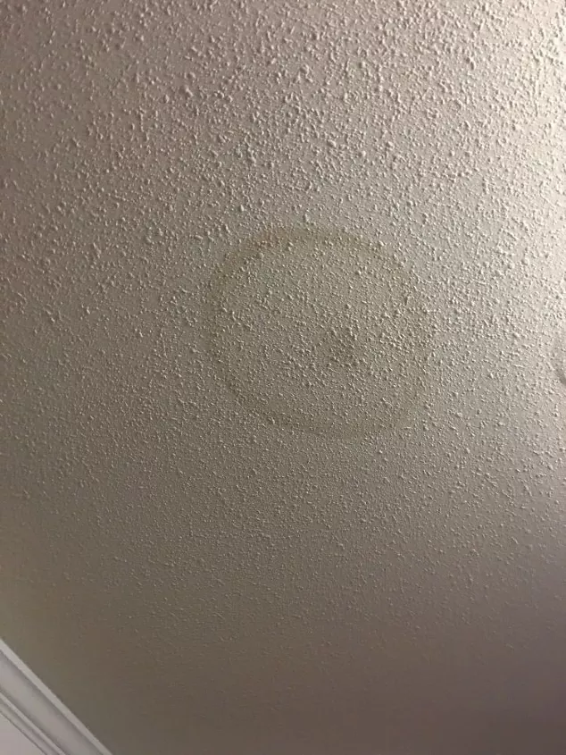Gray ceiling discoloration from water damage