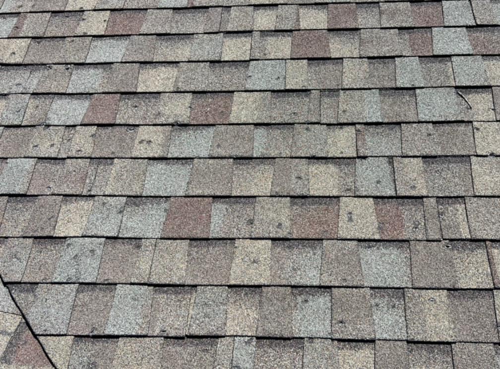 Hail impact damage on roof shingles